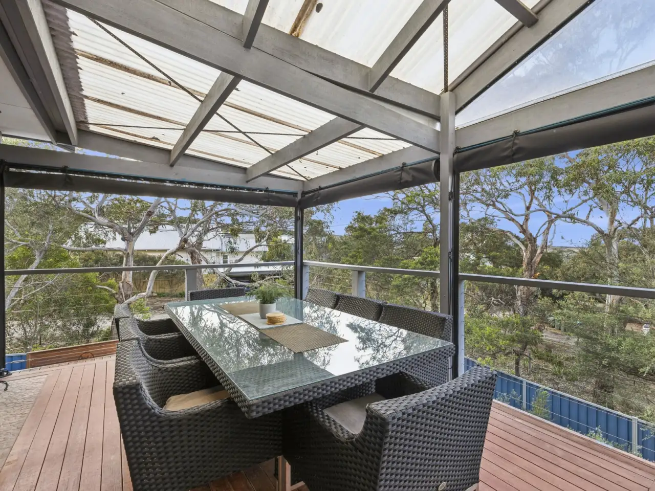 Outdoor dining setting on the covered upstairs deck